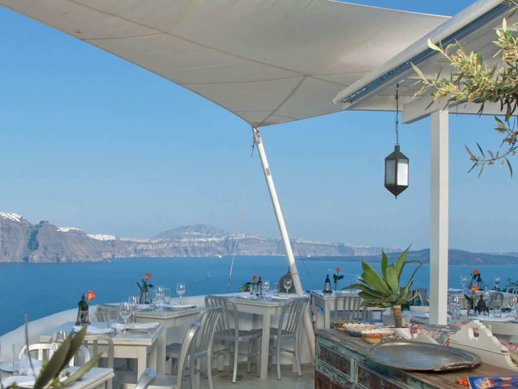 559c6e307772ff921f95ae2a_red-bicycle-santorini-greece