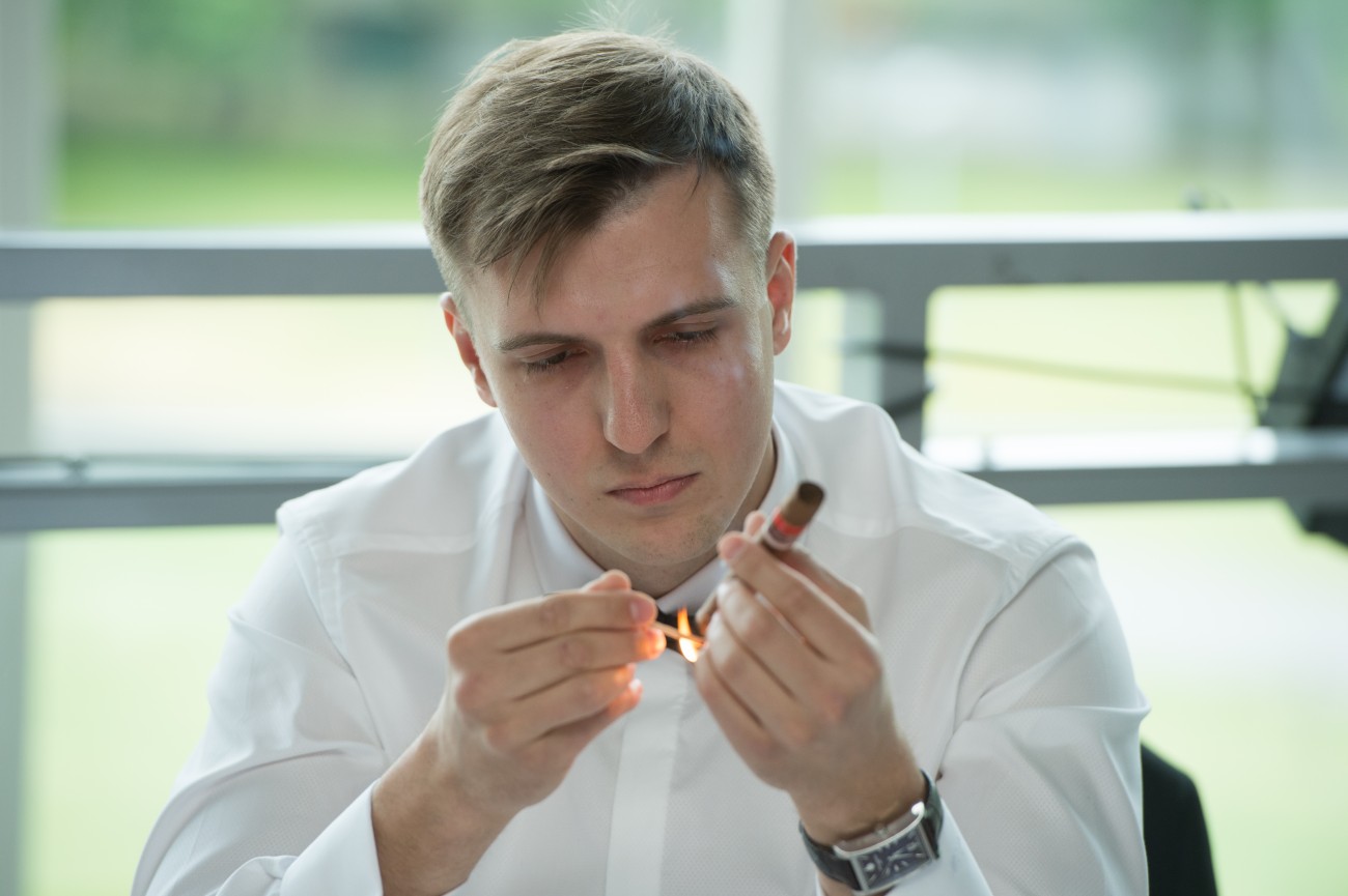 1. Oleg Pedan lighting his winning cigar